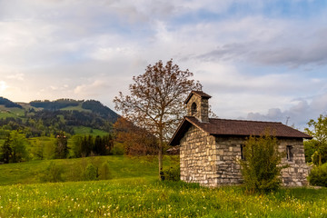 Obraz premium small old chapel in the swiss alps