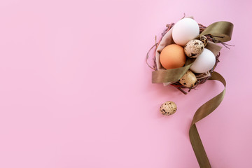 Easter composition with eggs on pink pastel background. Flatlay 