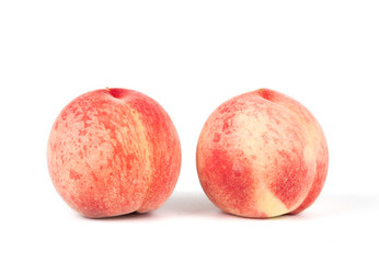 Fresh peach isolated on white background.