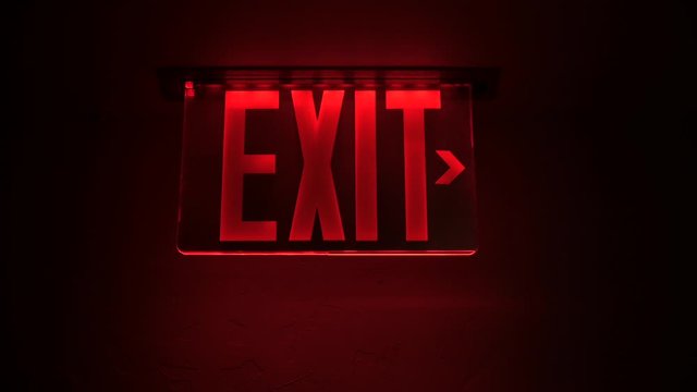 Red exit sign in a nightclub