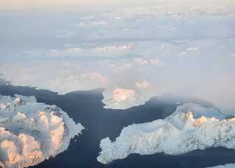 Aerial view of snow covered mountains and fjords in East Greenland, Maniitsoq