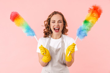 Housewife isolated holding colorful duster.