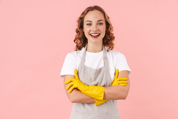 Cheerful woman housewife in gloves.