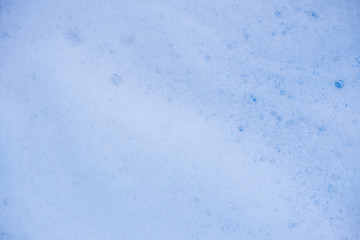 Abstract background white soapy foam texture. Shampoo foam with bubbles