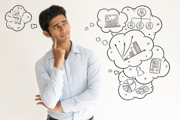 Skeptical Indian guy with hand drawn business sketches. Portrait of suspicious Indian. Sarcastic...