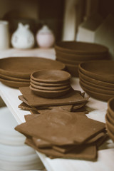 Manufacture of ceramic products, workpiece. Beautiful background with ceramic pieces of ware