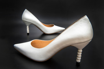 female shoes shiny stiletto on a black background