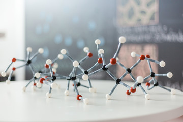 Molecular lattice classroom with blackboard in the background