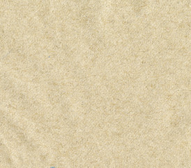 Texture of recycled paper in light brown tones.