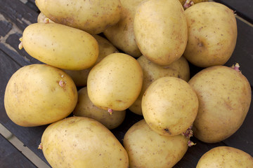 Potatoes, on wooden table, natural light