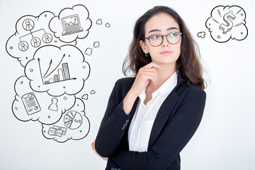 Confident woman looking away with hand drawn business sketches. Portrait of young Caucasian...