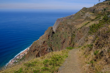 Fototapeta na wymiar Path and cliffs at Paul Do Mar, Madeira Island, Portugal