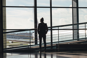 Fototapeta na wymiar Woman traveler on empty airport for Coronavirus.