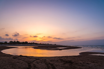 Fototapeta premium Sunset on the beach in Mediterranean Sea, Oliva, Valencia