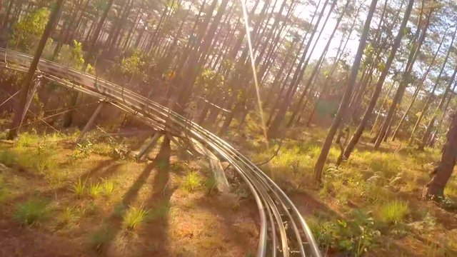 DALAT. VIETNAM: Unique Slide Rail System Moves Visitors on Winding Route through the Park at Datanla Falls. Vietnam. 4k video