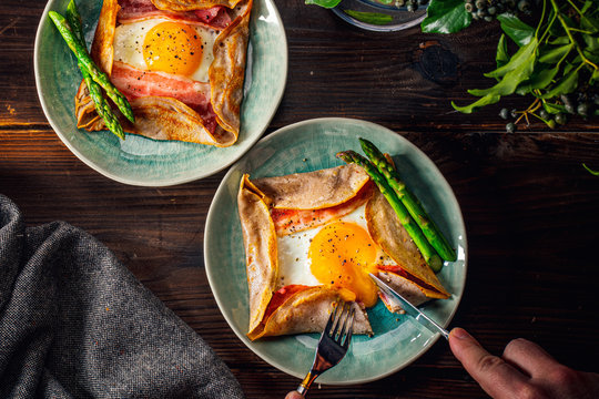 Galette,French food buckwheat pancake,with egg in plate. Healthy food concept image.