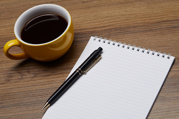 notebook and coffee on the table