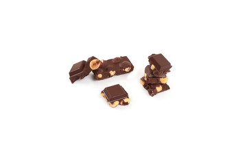 Chocolate pieces with nuts isolated on white background