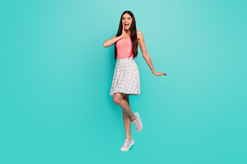 Full size photo of astonished positive cheerful girl rest relax see wonderful black friday sales news impressed scream wow omg wear pastel singlet shoes isolated pastel color background