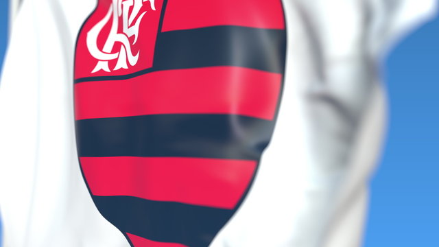 Waving flag with Clube De Regatas Do Flamengo football club logo, close-up. Editorial 3D rendering