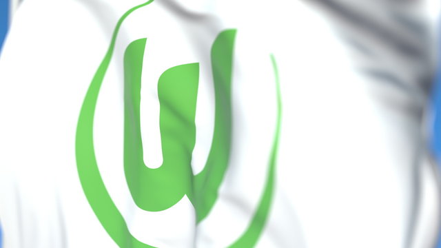 Flying flag with VFL Wolfsburg football club logo, close-up. Editorial 3D rendering