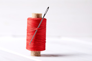 bobbins with thread and needles