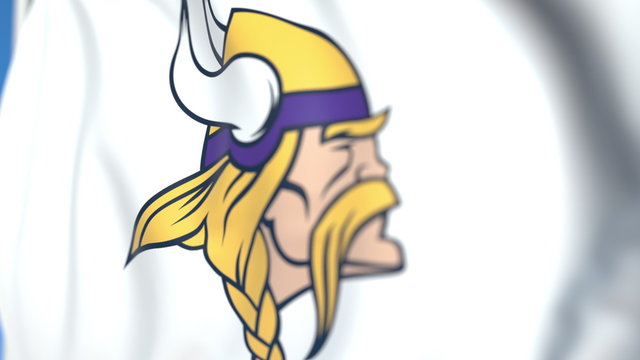 Waving flag with Minnesota Vikings team logo, close-up. Editorial 3D rendering