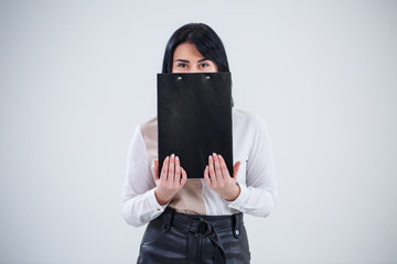 woman teacher, business coach, mentor holds a folder with a new business project in her hands