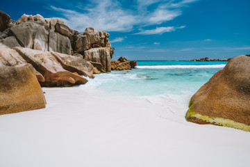 Anse Cocos, La Digue island, Seychelles. Tropical lagoon with granite boulders in the turquoise...