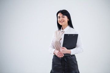 woman teacher, business coach, mentor holds a folder with a new business project in her hands
