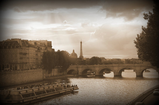Seine river with a tourist boat. Paris, France.Sepia tone.