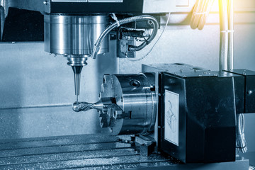 The 4 axis CNC milling machine cutting the sample parts attach on the rotary table with solid ball endmill tools. The hi-technology metalworking   manufacturing process by 4 axis machining center.
