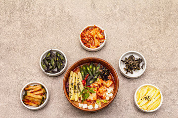 Traditional Korean spicy soup with kimchi, tofu, vegetables. Hot dish for healthy meal