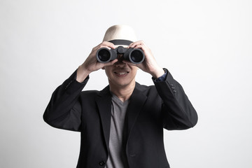 Adult Asian man with binoculars.