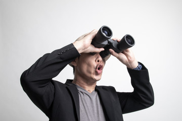Adult Asian man  with binoculars.