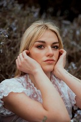 Portrait of a blonde woman in the nature