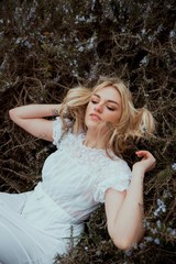Portrait of a blonde woman in the nature