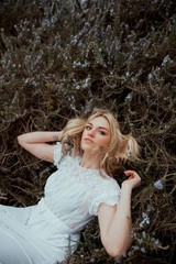 Portrait of a blonde woman in the nature
