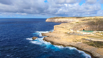 Flight over Dwerja Bay at the coast of Gozo Malta - aerial photography