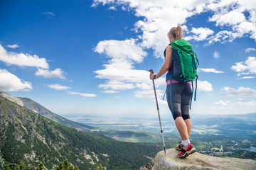 Young woman hiking in the mountains