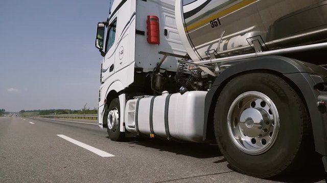 Gasoline tanker, Oil trailer, truck on highway. Speeding Truck on the Highway.