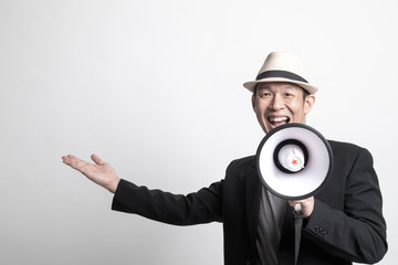 Adult Asian man    announce with megaphone.