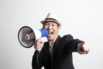 Adult Asian man  announce with megaphone.