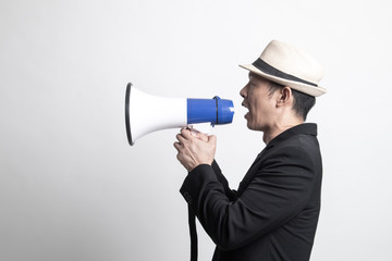 Adult Asian man  announce with megaphone.