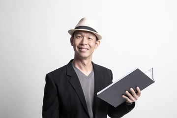 Adult Asian man with a book.