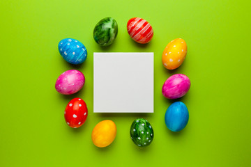 Bright easter eggs with copy space for text on green background. Retro colorful spring decoration.