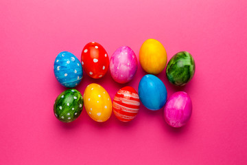 Bright easter eggs on pink background. Retro colorful spring decoration.