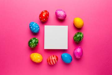 Bright easter eggs with copy space for text on pink background. Retro colorful spring decoration.