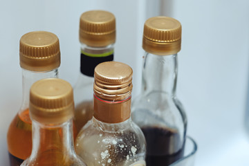 five glass bottles with liquid