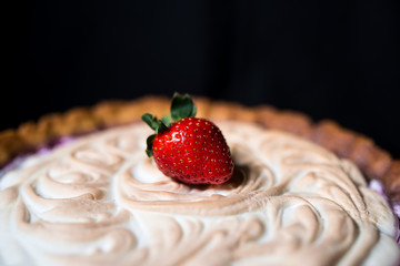 large strawberries on a black background